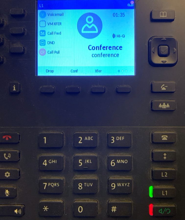 Phone screen displaying you are in conference